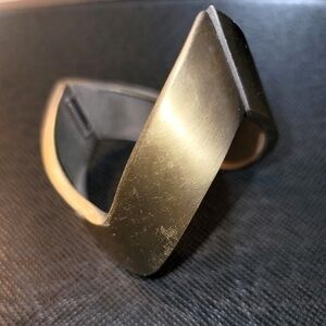 Futuristic golden bracelet. Has some scratches.